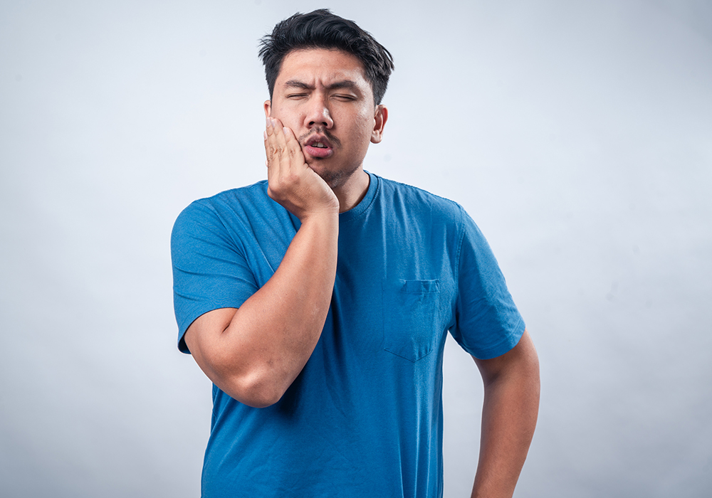 Man with tooth pain seeking 24 Hour Emergency Dentists