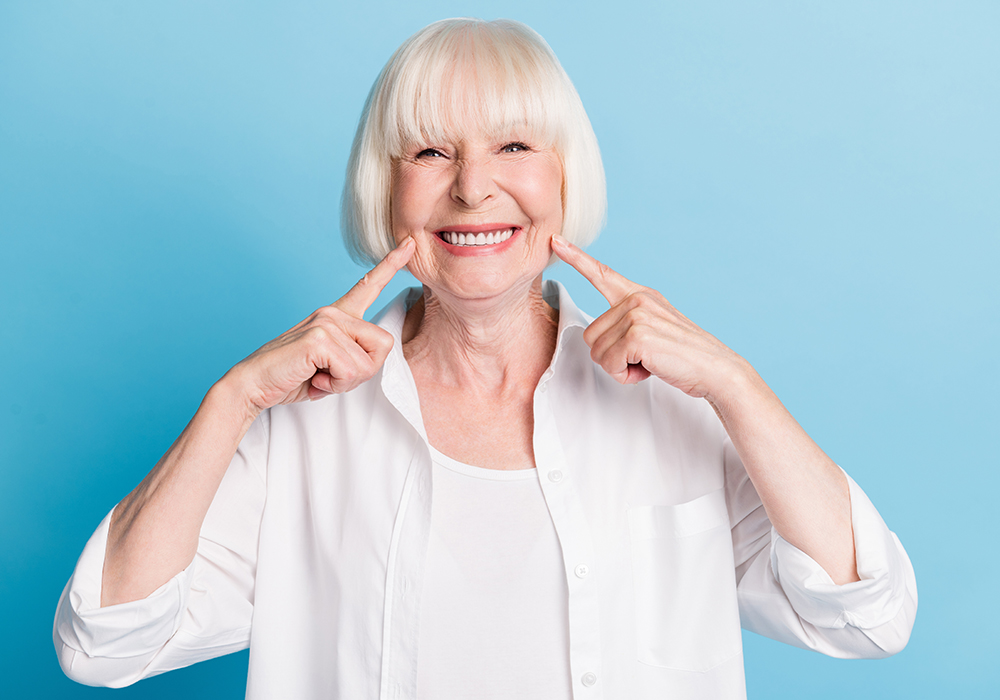 Smiling elderly woman with dentures