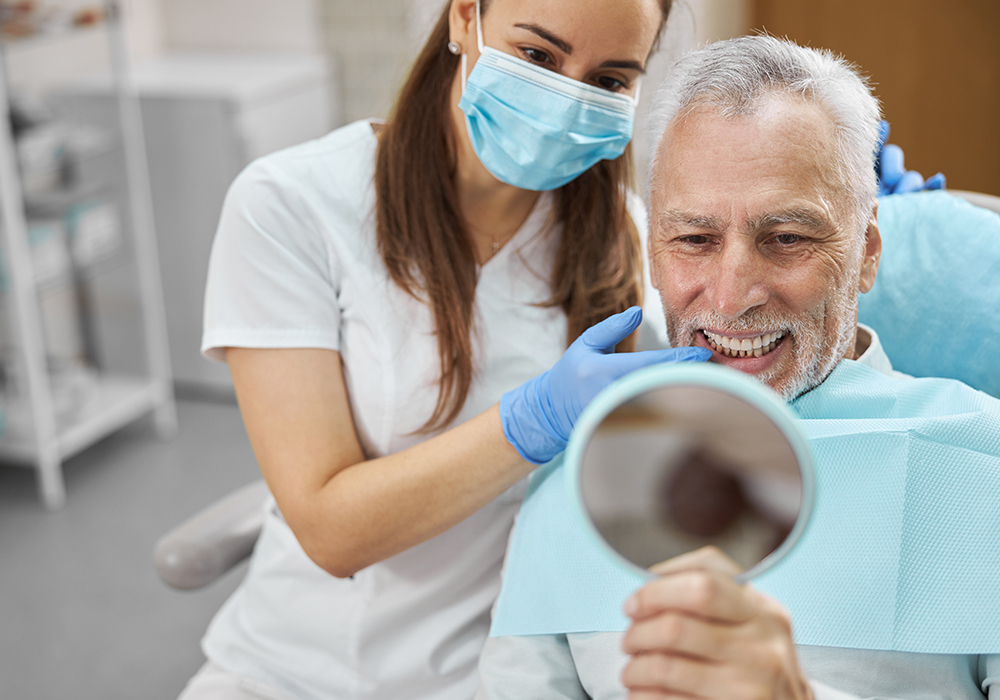 elderley man denture fitting