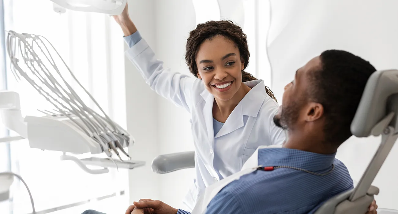 dentist preparing to inspect patients mouth