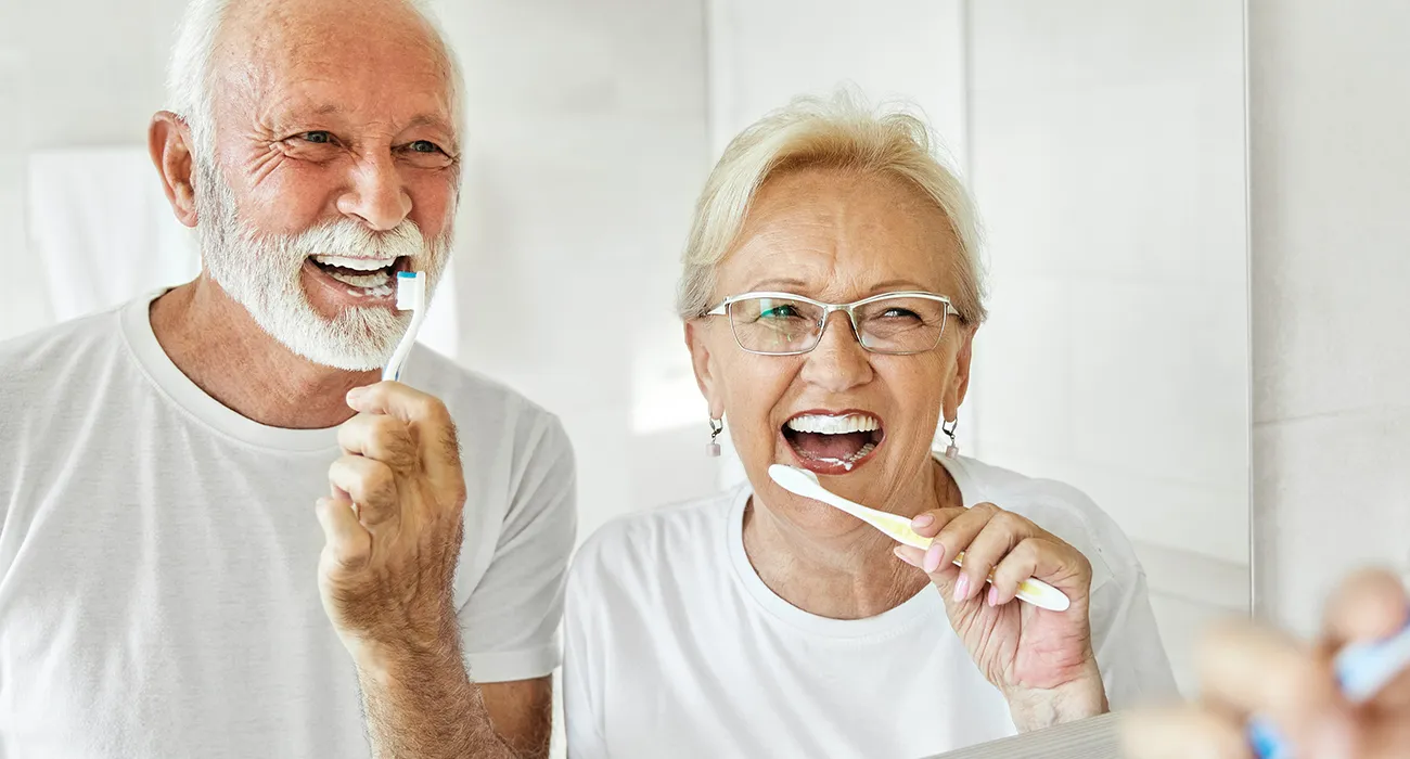 Senior couple caring for their teeth